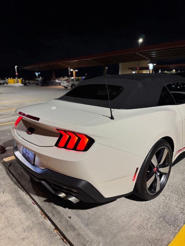 Rear view of white convertible sports car, luxury car rental in South Florida