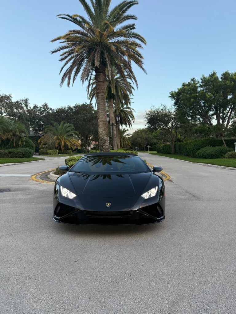 Lamborghini Huracán EVO Spyder front view under palm trees in Miami