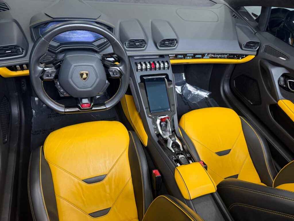 Lamborghini Huracán EVO Spyder yellow and black leather interior and dashboard